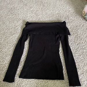 black form fitting off the shoulder sweater